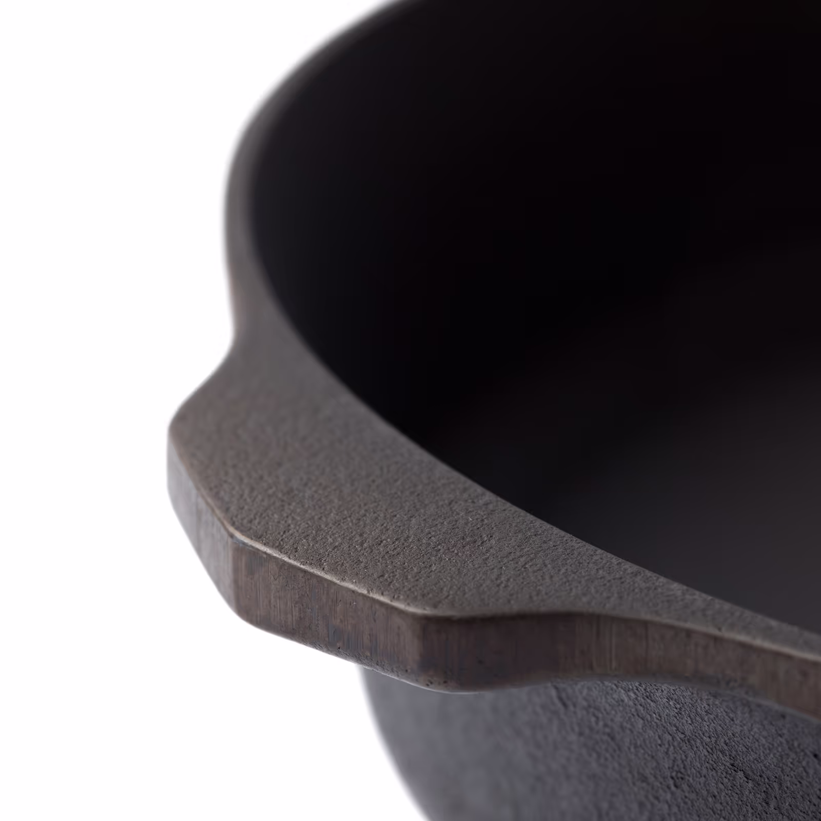 close up of a cast iron on a white backdrop